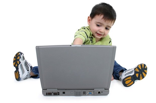 small child using a laptop